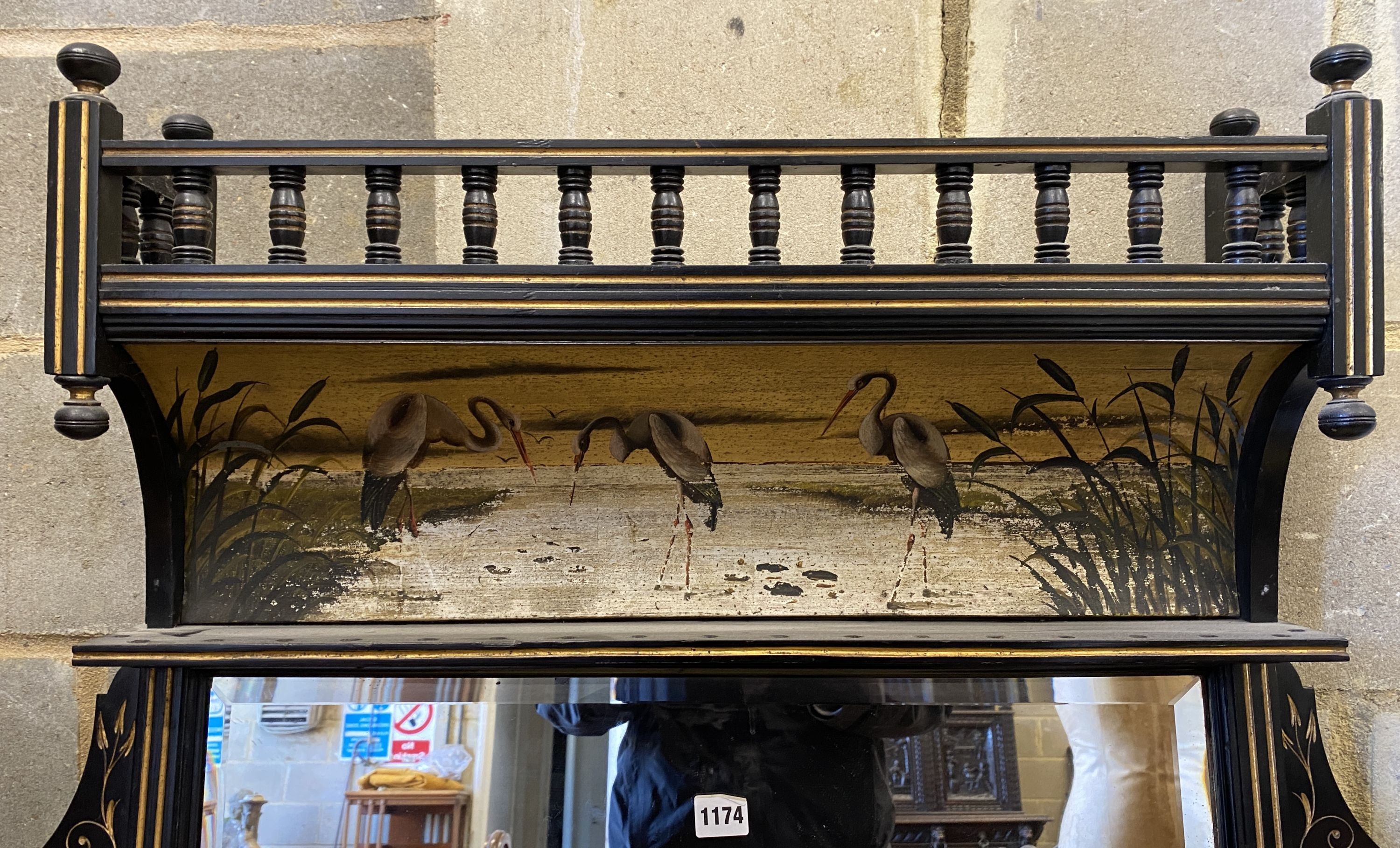 A late Victorian Aesthetic Movement parcel gilt ebonised over-mantel mirror, width 134cm, height 153cm